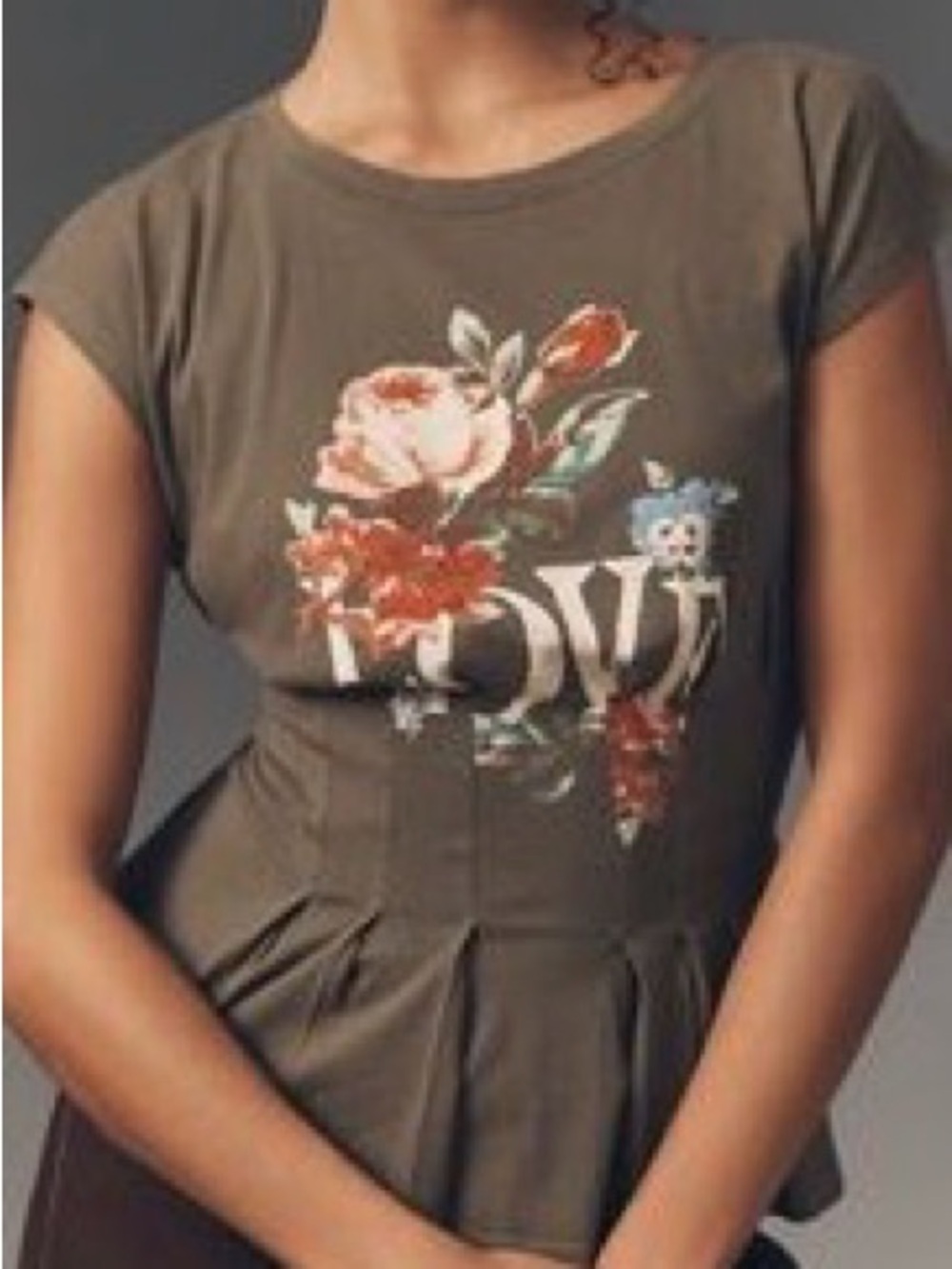 Anthropologie graphic darted peplum tee.